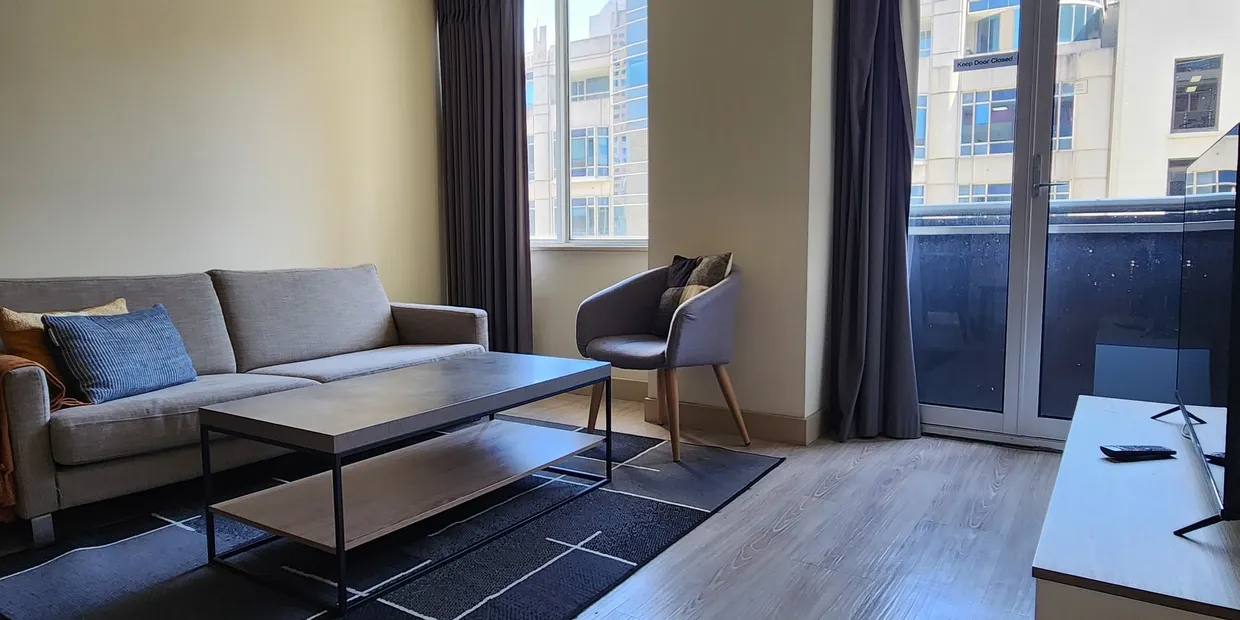 Modern living room with sofa and chair.