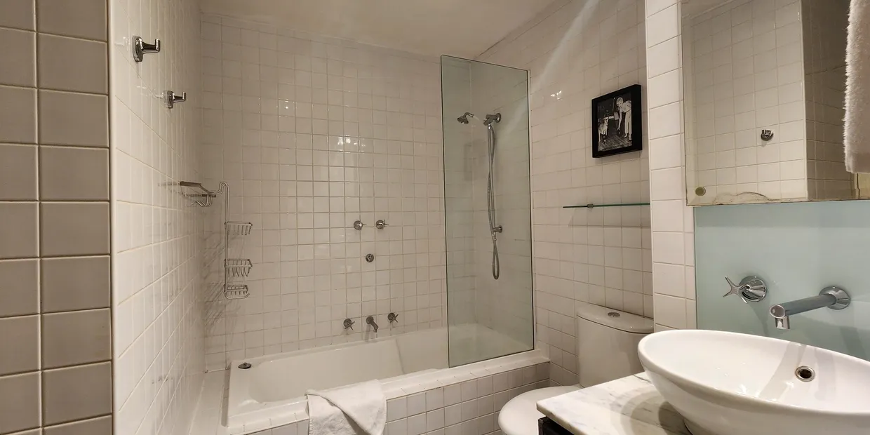 Modern bathroom with bathtub and sink.